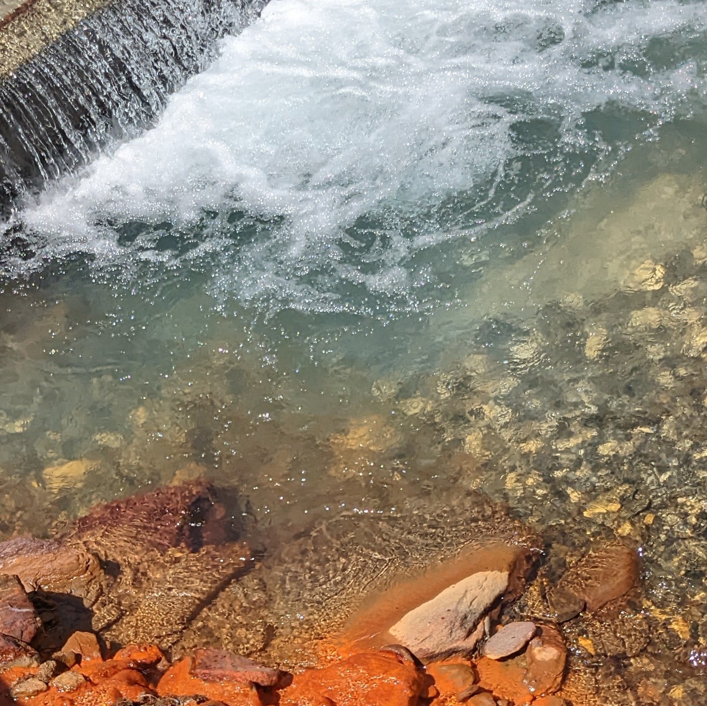 swiss stream with bright colours